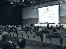 View over the audience to the podium
