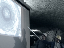 Two members of staff of Asse GmbH evaluate footage of bore hole inspection