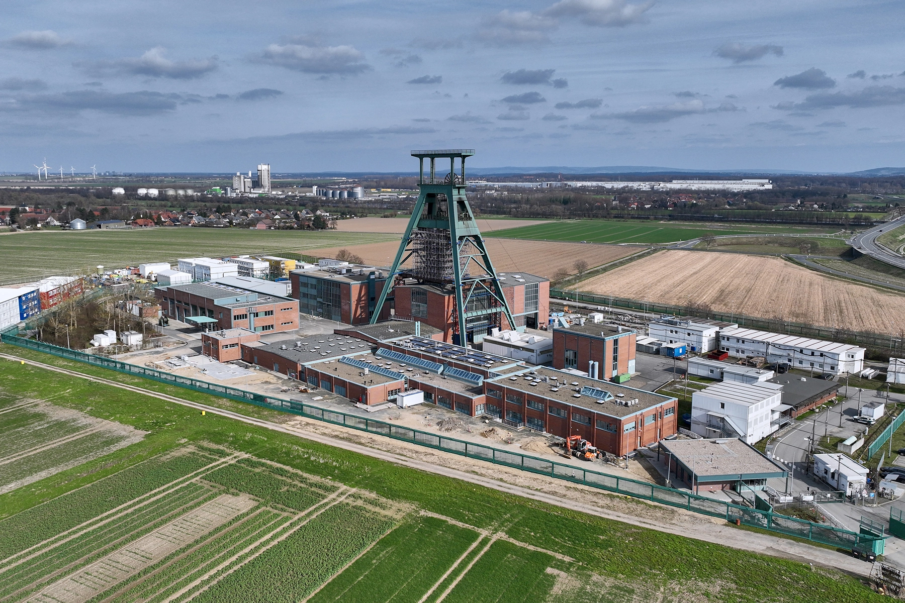 Aerial view of the Konrad 1 mine with the listed headframe. Fields stretch out all around.