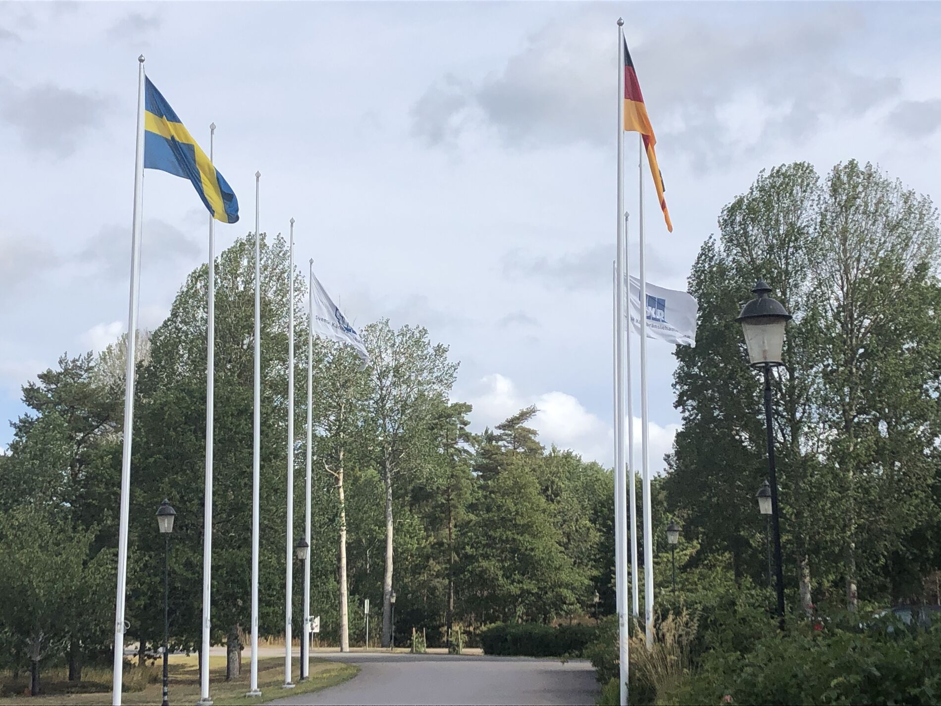 Flagpoles with the Swedish and German flags