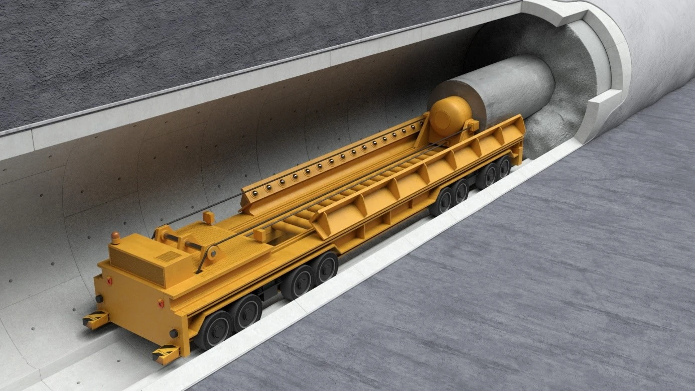 Zu sehen ist ein gelbes Rückholungsfahrzeug im Querschnitt eines Einlagerungsstollens, mit dem aus dem verfüllten Stollen den Endlagerungsbehälter geborgen wird.