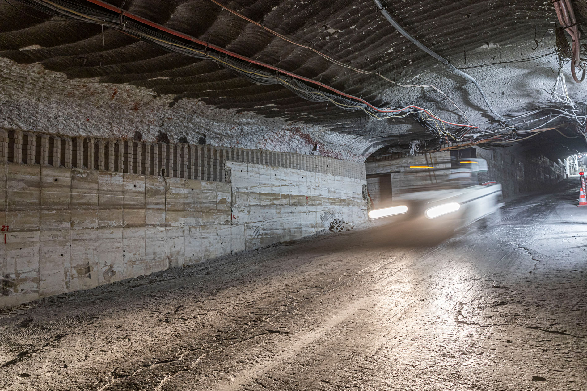 A vehicle drives on an underground route through the Asse II mine