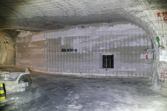 Construction Site underground with a white wall in the background