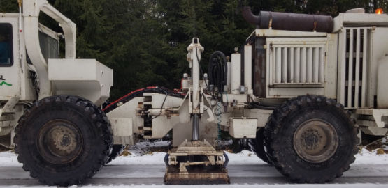 A vibration vehicle on a snowy surface. Link to page "Technology"