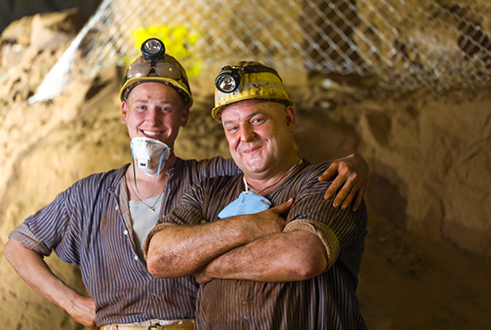 Picture of two employees underground.